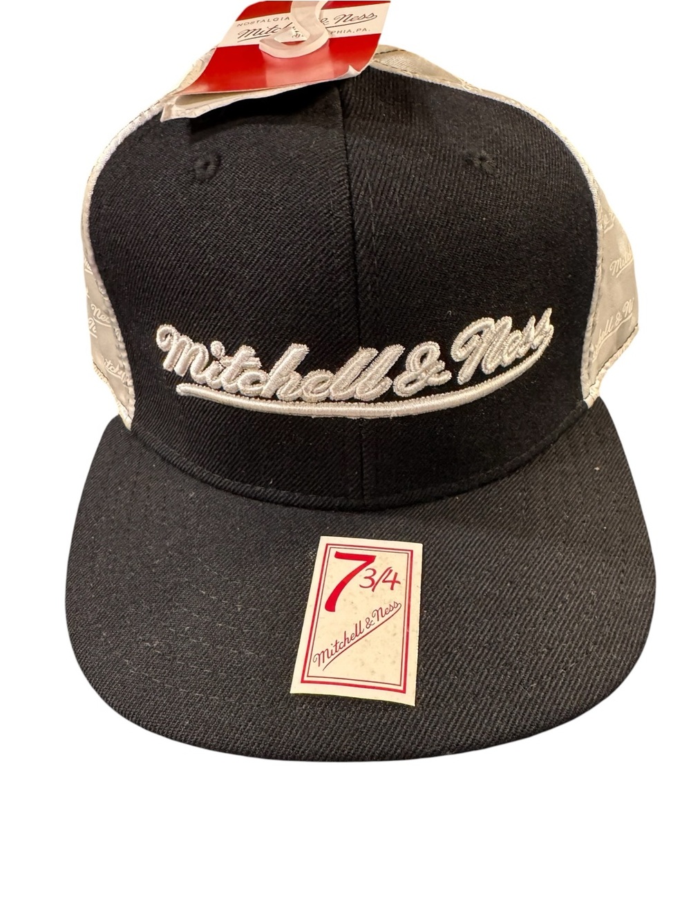 7 3/4 Mitchell & Ness Black and White with Satin sides.